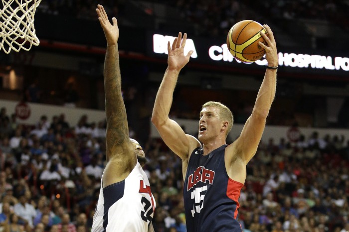 Brooklyn Nets' Mason Plumlee, right, goes up for a shot against Sacramento Kings' DeMarcus Cousins during the USA Basketball Showcase game Friday, Aug. 1, 2014, in Las Vegas. (AP Photo/John Locher)