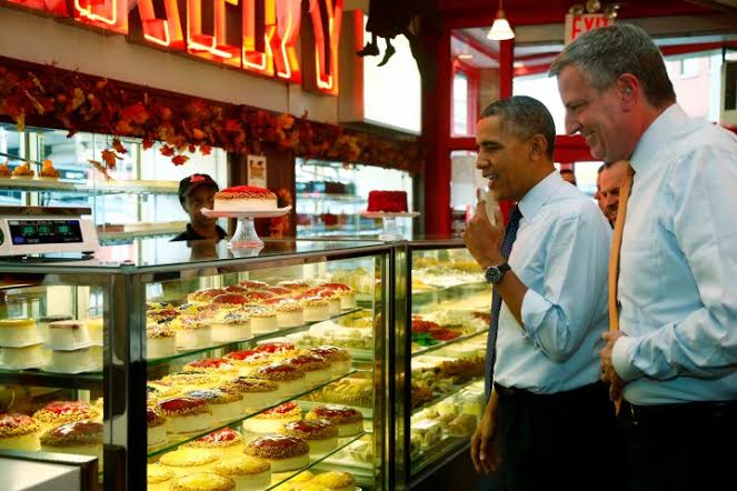 President Barack Obama and New York City Democratic Mayoral Candidate Bill de Blasio visits Junior's Cheesecake restaurant in the Brooklyn borough of New York, Friday, Oct. 25, 2013. (AP Photo/Charles Dharapak)