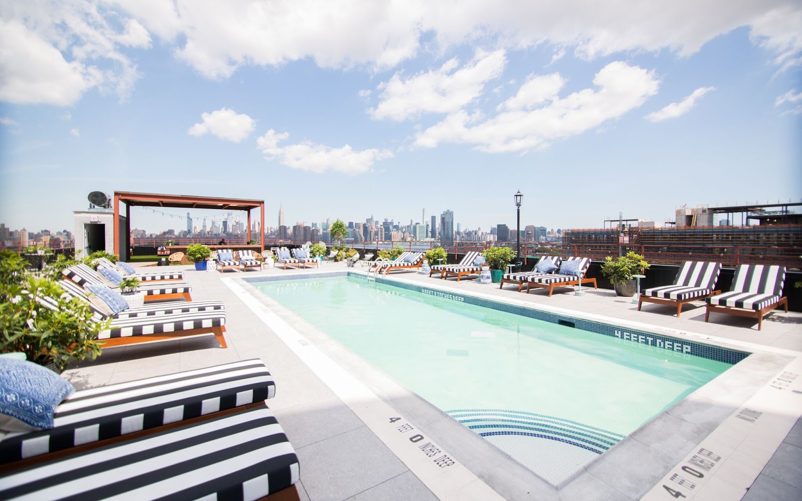 The Rooftop Pool & CBD Laced Cocktails Make The Williamsburg Hotel This Summer's Hottest Brooklyn Destination